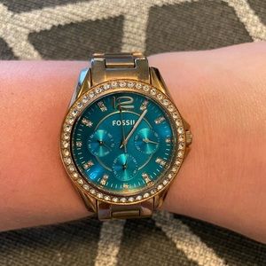 Rose gold fossil watch with tortuous blue face